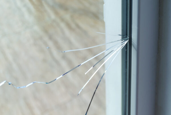 Close-up of cracked glass window.