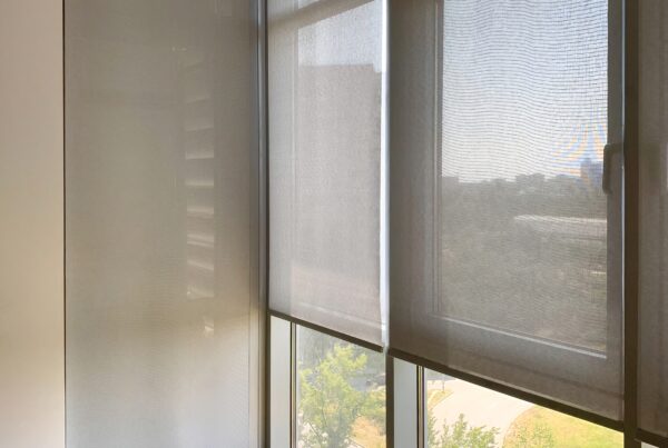 Sunny room with yellow chair and sheer window blinds